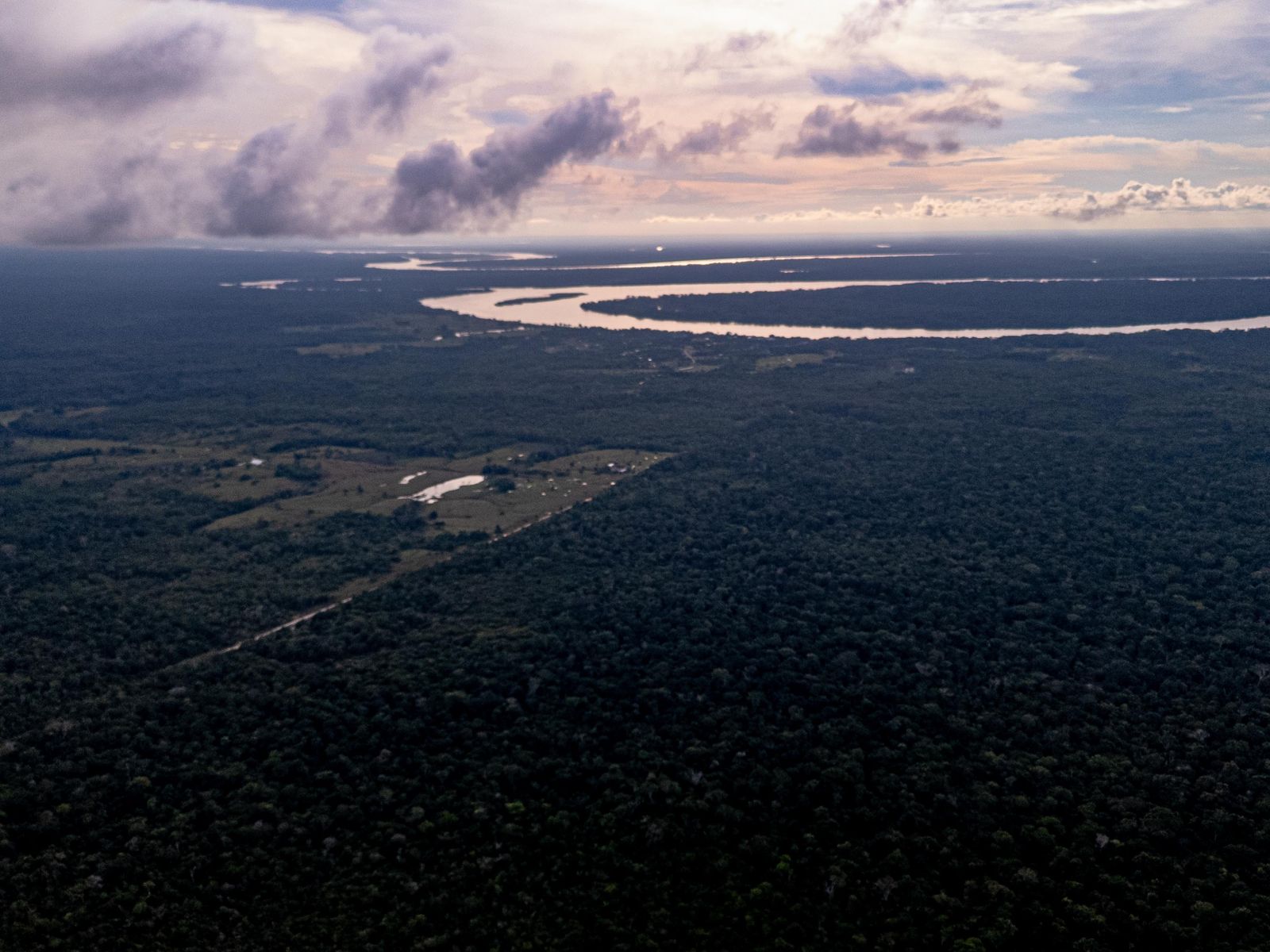 A river meander under an evening sky